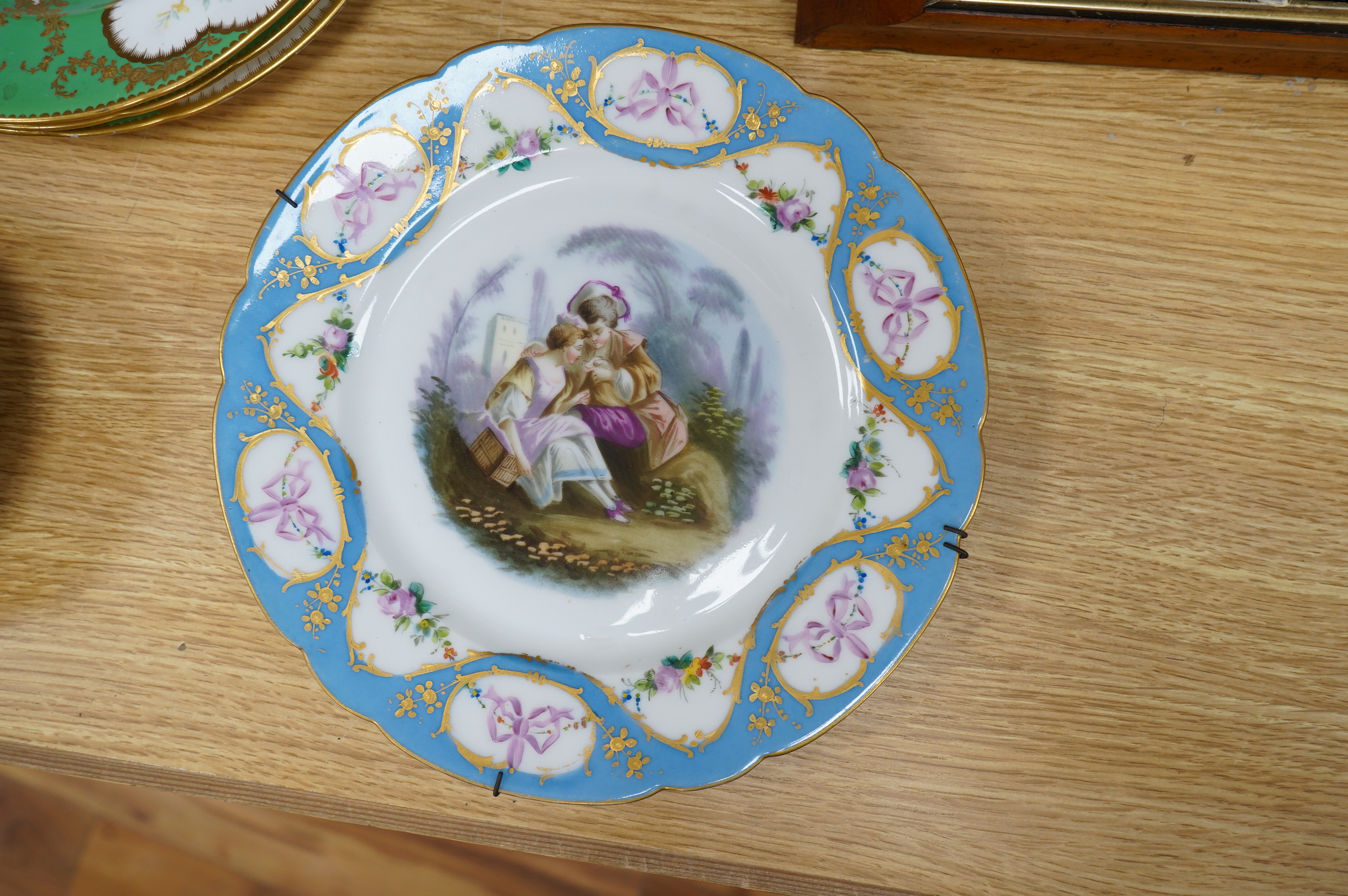 Three Sevres style plates, a Sevres coffee can and saucer and a similar plate, coffee can 7cm high. Condition - good